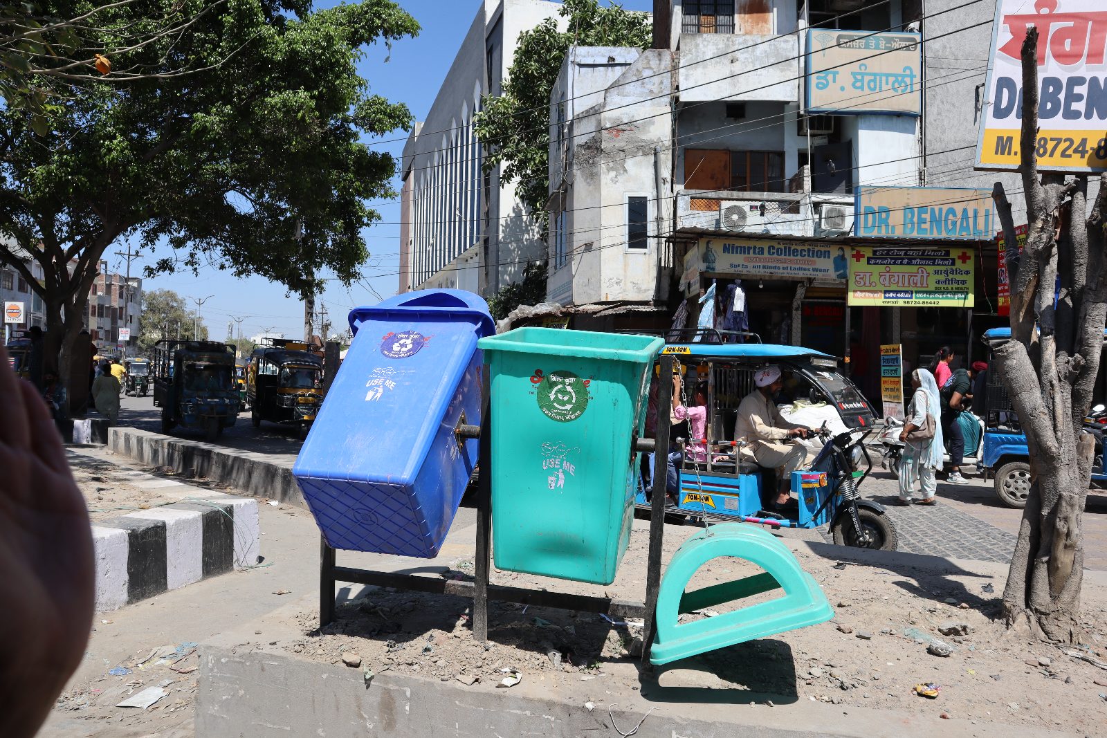Row of colour-coded public waste segregation bins
