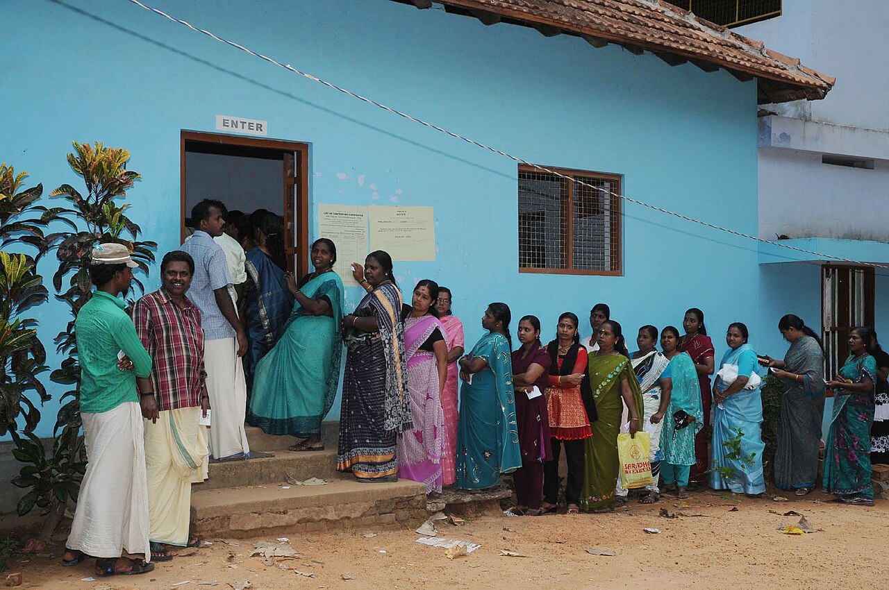 Voters queue at a polling station in Thiruvananthapuram during the 2011 Kerala Assembly election